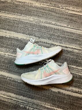 Nike Women's White Mesh Running Shoes with Pink Swoosh and Green Accents